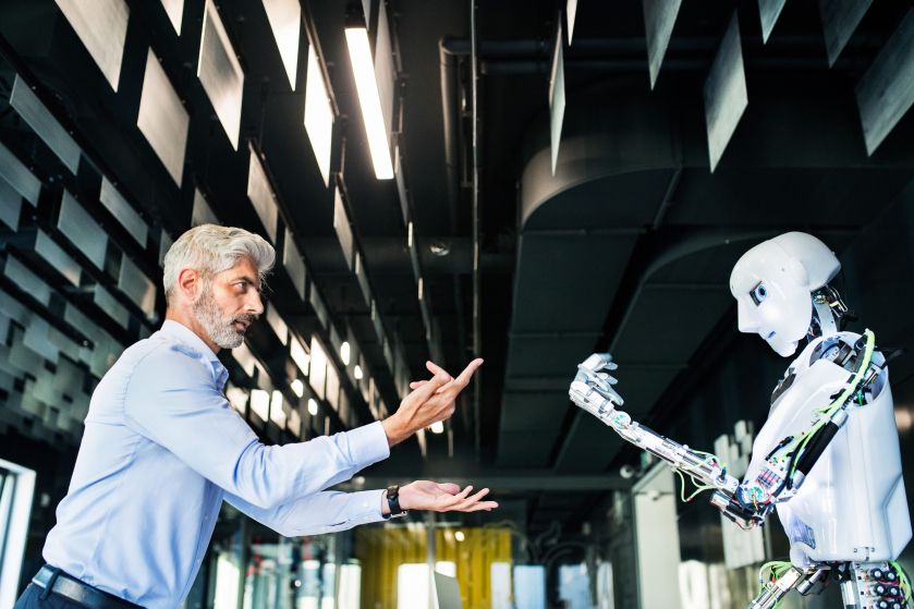 Mature businessman or a scientist with robot. (2) (1).jpg
