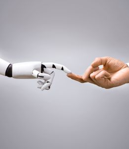 Robot Touching Human Finger Against Gray Background (1).jpg